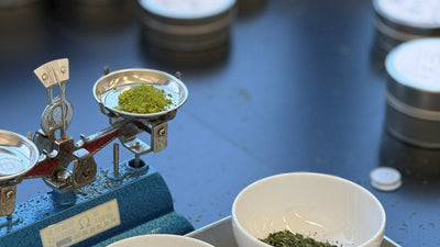 Tencha leaves and matcha powder with sample tins